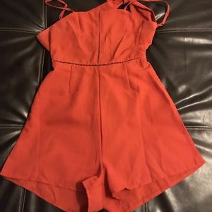 Orange knotted eyelet cami romper